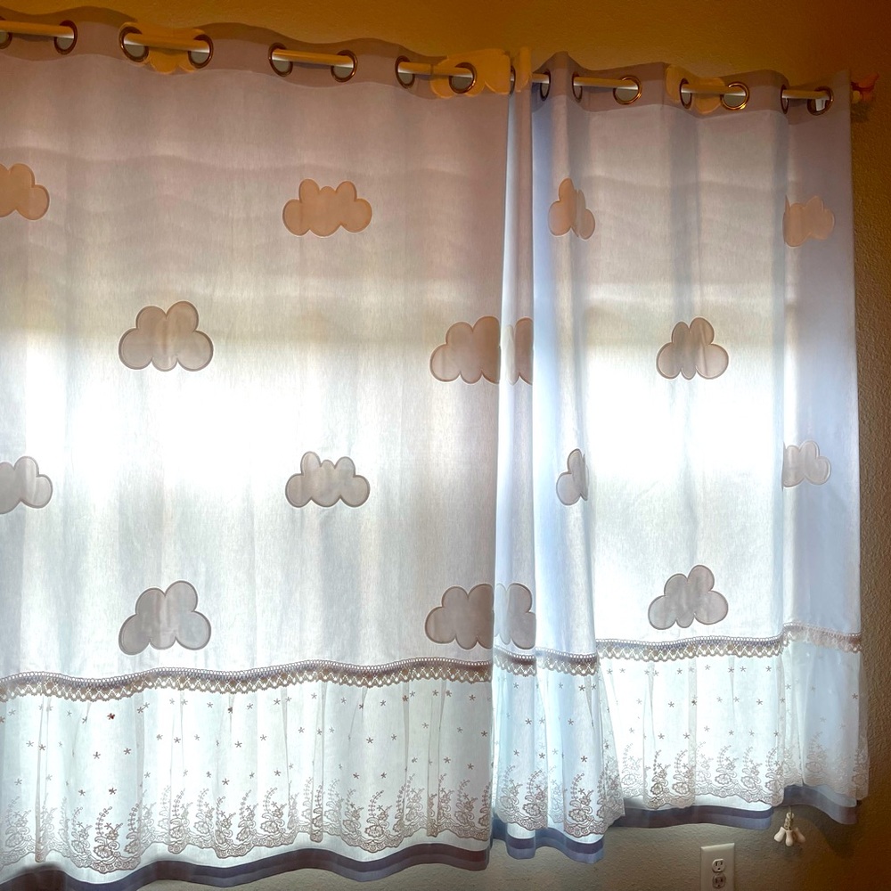 Very cute cloud curtains with rod and little yellow birdies on the end